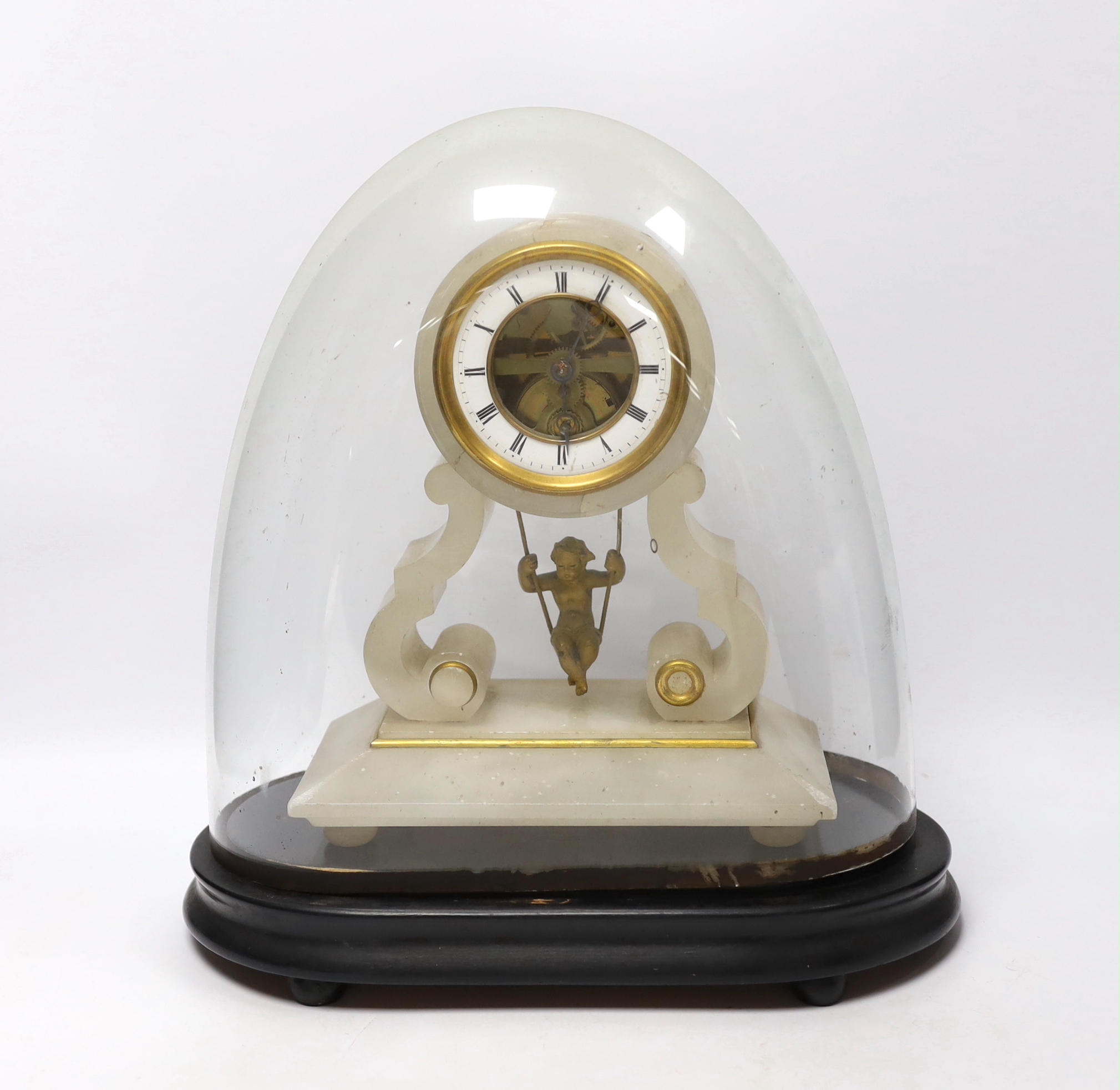 A late 19th century French alabaster and gilt metal mantel clock, with ebonised stand and glass dome, total height 32.5 cm